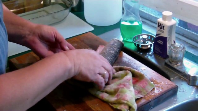 Woman gets fright of her life while scaling decapitated fish when it starts MOVING in her hands