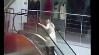 A lady who climbs the escalator in reverse ..!