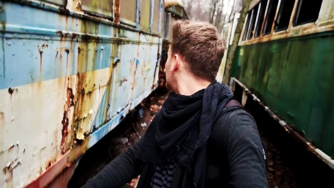 MASSIVE ABANDONED TROLLEY GRAVEYARD IN WOODS