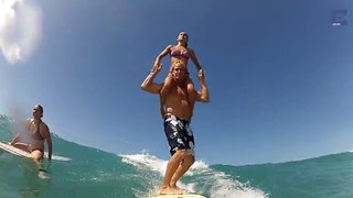 Two Surfers Perform Acrobatics