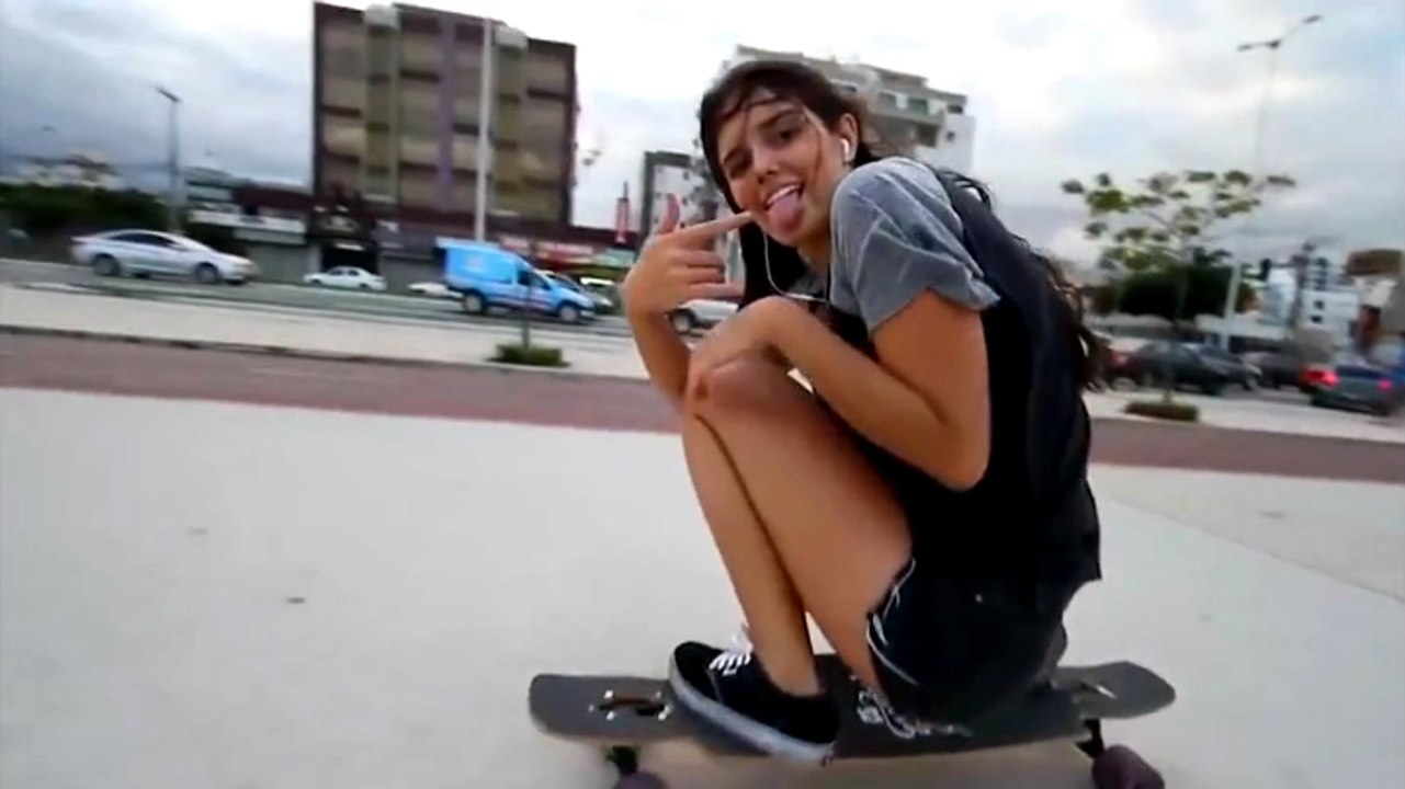 Girl Dances While Longboarding
