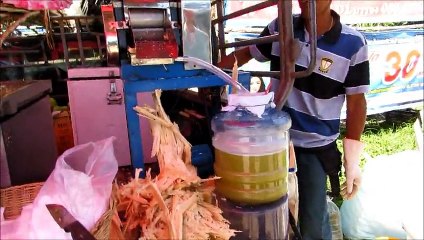 Sugar cane juice and opening the coconut - Koh Chang, Thailand