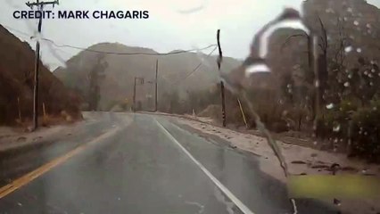Driver Escapes from Flash Floods