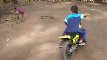 whatsapp latest funny videos small kid showing stunts on his mini bike - Copy (18) - Copy