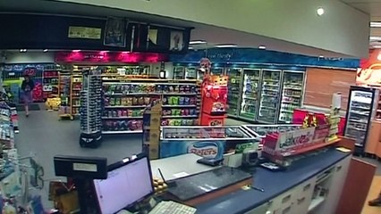 Car crashes into service station almost hitting woman