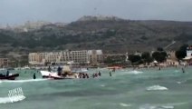 The horrifying moment a parasail rope snaps as a boat is hit by a freak storm in Malta