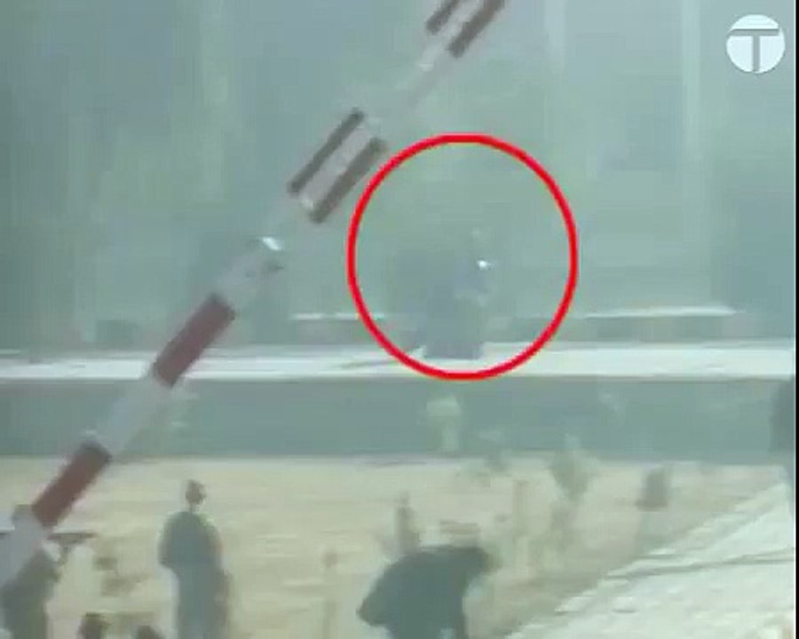 A female student being escorted out of Bacha Khan University during the attack