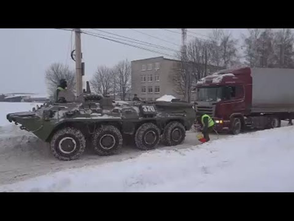 BTR-80 APC rescues truck stuck in snow in Russia