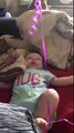 Cute Baby Laughing At Balloon Tied With His Leg