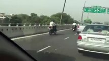 Dog wearing helmet and sitting behind bike rider in Bangalore !!!