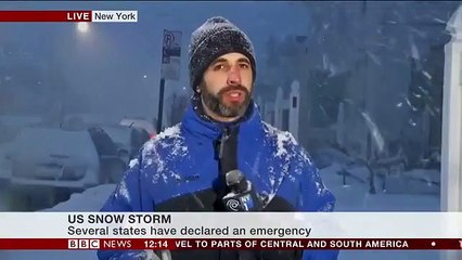 Blizzard 2016 is affecting New York, demonstrated by an umbrella and a rule