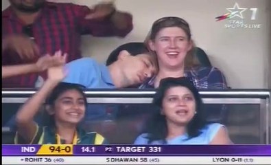 cricket spectator sleeping - putting head on her shoulder