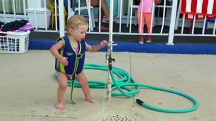 Adorable Baby Girl Battles The Water Hose