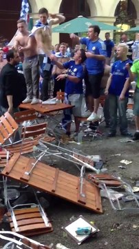 Chelsea hooligans trashing a Bar in Munich and attacking the owner as he attempts to stop them