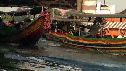 boats traveling threw a lock gate Bangkok Thailand