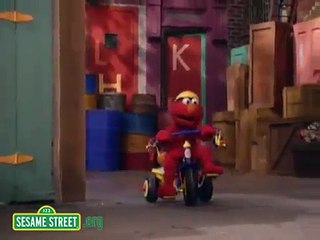 Sesame Street: Elmo Riding A Tricycle