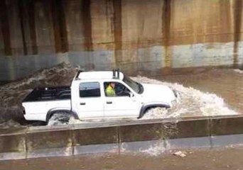 Cars Drive Through Deep Floodwaters in Adelaide