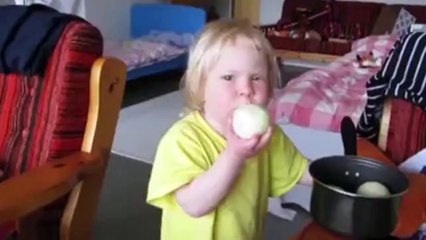 Russian child eats onions.