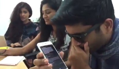 A man asks Siri to calculate "1 trillion Power 10" in order to achieve an Indian song.
