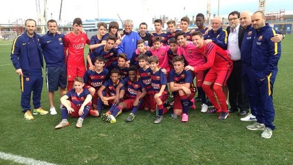 Xavi Hernández watches the FC Barcelona U14 team in action in Qatar