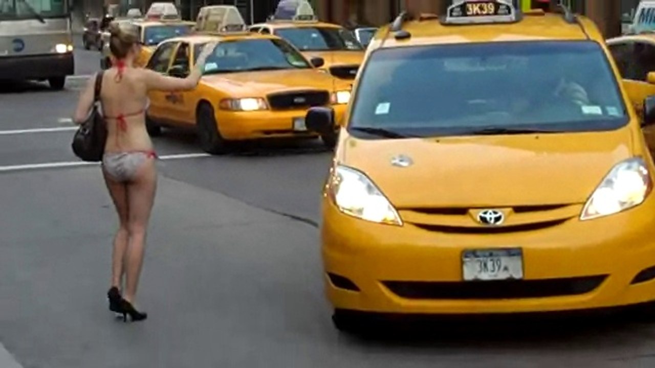 Chick hails cab in bikini
