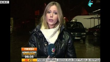 Man wields 'gun' in front of reporter on live TV