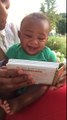 Baby Boy Laughs Hysterically at Book of Animals