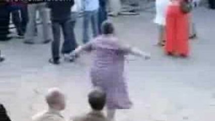 Old woman dancing techno music