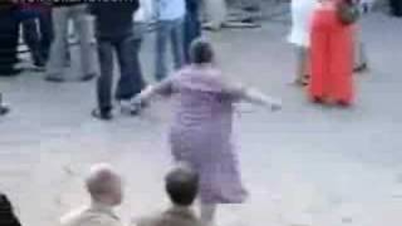Old woman dancing techno music