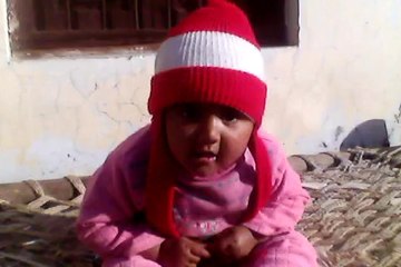 A baby is happily playing