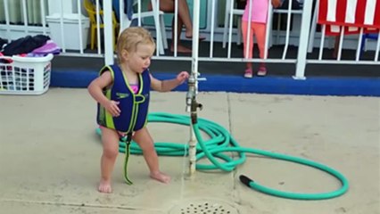 Adorable Baby Girl Battles The Water Hose