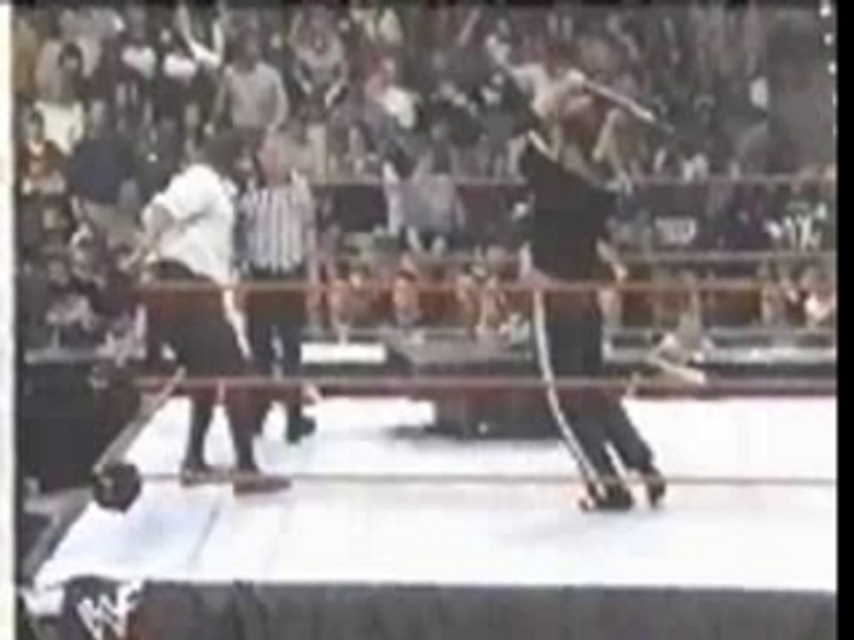 The Rock hits himself with a chair