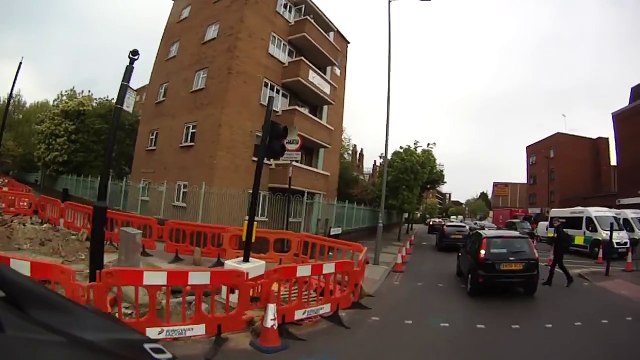 Met Police hunting thug who shoved a woman off her bike