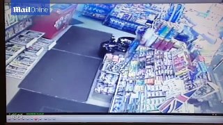 Raw video : The moment cashier dips her fingers into the newsagent till