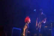 Members of Paramore lie down on Stage with fan who fell during Concert