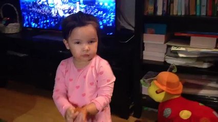 Daniella singing and playing with our Bichon Frise