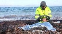Stunned silence for drowned migrant girl found washed up on Greek island