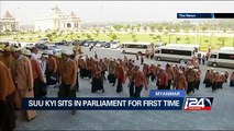 Suu Kyi sits in Parliament for first time