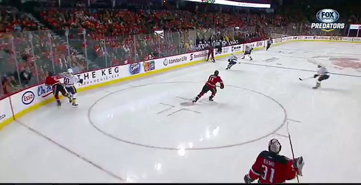 Dennis Wideman cross checks linesman Don Henderson