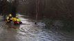 Cyclist rescued after being swept away by flooded river in Devon