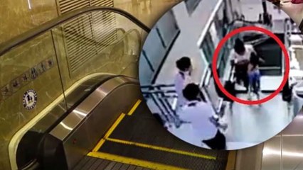 China woman dies after falling into escalator