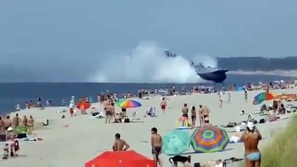 Russian Navy Hovercraft Lands On Busy Beach