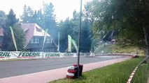 Drifting race car sends tire flying into the crowd