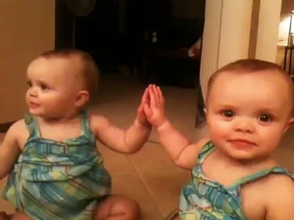 Her first kiss, cute, funny baby girl kissing in the mirror