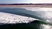 Stealth Shark Swims beneath Surfers - Drone Footage