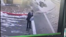 Man falls down pavement trying to spread Salt on Ice!