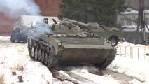 Russian Daredevil Snowboarders Pulled by Infantry Fighting Vehicle