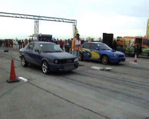 Скачать видео: Audi 90 Quattro Turbo Vs. Subaru Impreza WRX STI Drag Race