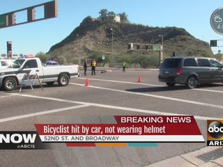 Bicyclist hit by car, not wearing helmet