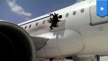 Large hole appears in the side of a Daallo Airlines plane, forces plane to make emergency landing